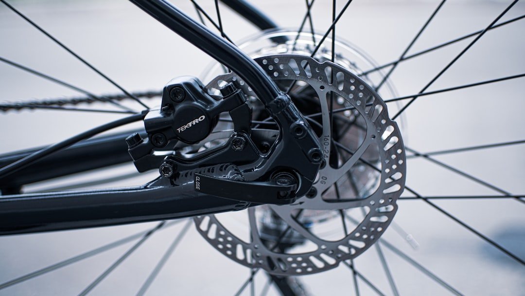 A close-up view of an electric bike showcasing its battery, motor, and control panel.